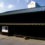 Traditional Japanese building with blue roof.